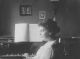 Ingeborg Norlin sitter vid pianot i Lund 1914, året efter att denna bild tog gifter hon sig med min farfars farbror Arvid Hallenberg