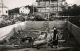 Mormors Emy står med skottkärra, husbygge på Gökevägen 18, ca 1950